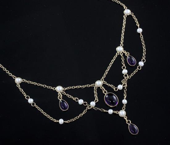 A Victorian style 9ct gold, cabochon amethyst and seed pearl drop necklace, 60cm.